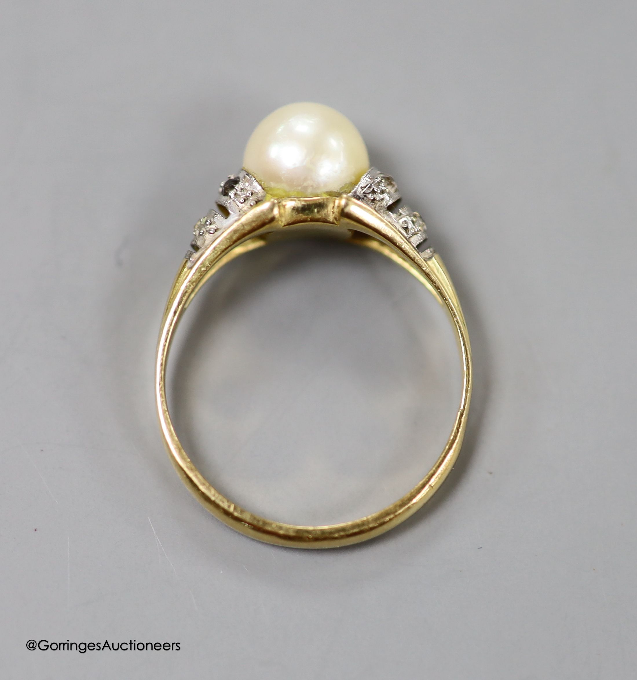 A modern yellow metal, cultured pearl and gem set ring, size O, gross weight 3.3 grams